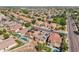 Aerial view of a neighborhood with homes, landscaping, solar panels and streets at 16118 W Port Au Prince Ln, Surprise, AZ 85379