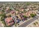 Aerial view of a neighborhood featuring houses with solar panels and well-maintained landscaping at 16118 W Port Au Prince Ln, Surprise, AZ 85379