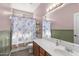 Bathroom with modern fixtures, ample lighting, and a shower-tub combo at 16118 W Port Au Prince Ln, Surprise, AZ 85379