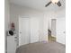 A well-lit bedroom with closet and access to the hall exudes an inviting atmosphere at 16118 W Port Au Prince Ln, Surprise, AZ 85379