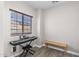 Bonus room with piano and bench seat providing many potential activities at 16118 W Port Au Prince Ln, Surprise, AZ 85379