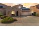 Charming single-Gathering home with a two-car garage, desert landscaping and solar panels on the roof at 16118 W Port Au Prince Ln, Surprise, AZ 85379