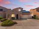 Charming single-Gathering home with a two-car garage, desert landscaping and solar panels on the roof at 16118 W Port Au Prince Ln, Surprise, AZ 85379