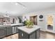 Open kitchen offers a large island, stainless steel appliances, and a connected dining area at 16118 W Port Au Prince Ln, Surprise, AZ 85379