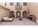 Private outdoor patio features string lights, lounge seating, a grill, and an arched walkway at 16118 W Port Au Prince Ln, Surprise, AZ 85379