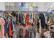 Walk-in closet featuring ample shelving and hanging rods at 16118 W Port Au Prince Ln, Surprise, AZ 85379