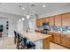 Kitchen with granite countertop island and stainless steel appliances, perfect for cooking at 16426 W Piccadilly Rd, Goodyear, AZ 85395