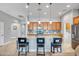 Spacious kitchen with a large island, granite countertops, and stainless steel appliances at 16426 W Piccadilly Rd, Goodyear, AZ 85395