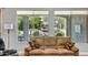 Living room featuring large window with tranquil outside view for peaceful living at 16426 W Piccadilly Rd, Goodyear, AZ 85395