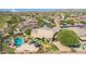 Stunning aerial view of home, pool, and desert landscape with mountain views at 18199 W Buckhorn Dr, Goodyear, AZ 85338