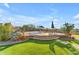 Expansive backyard with comfortable seating, hammock, lush turf, and scenic views perfect for outdoor relaxation at 18199 W Buckhorn Dr, Goodyear, AZ 85338