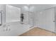 Well-lit bathroom with tile floors, separate tub and shower, and a large window at 18199 W Buckhorn Dr, Goodyear, AZ 85338