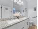 Bright bathroom featuring dual sinks, granite countertops, and stylish decor at 18199 W Buckhorn Dr, Goodyear, AZ 85338