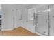 Bathroom with tile floors, separate tub and shower, and a door to the outside at 18199 W Buckhorn Dr, Goodyear, AZ 85338
