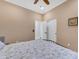 Neutral bedroom with ample closet space and ceiling fan at 18199 W Buckhorn Dr, Goodyear, AZ 85338