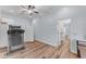 Spacious bonus room showcasing wood-look flooring, a ceiling fan, and potential for versatile use as a gym at 18199 W Buckhorn Dr, Goodyear, AZ 85338