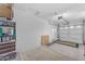Organized garage with storage options, garage door, and concrete floors, creating a practical space for vehicles and projects at 18199 W Buckhorn Dr, Goodyear, AZ 85338