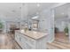 Spacious kitchen featuring granite counters, a large island, and a convenient pantry at 18199 W Buckhorn Dr, Goodyear, AZ 85338