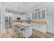 Modern kitchen featuring white cabinets, stainless steel appliances, and large island at 18199 W Buckhorn Dr, Goodyear, AZ 85338