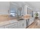 Well-lit kitchen featuring granite counters, a window, and stainless steel appliances at 18199 W Buckhorn Dr, Goodyear, AZ 85338