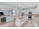 Spacious kitchen with island, stainless appliances, and seamless flow to living spaces at 18199 W Buckhorn Dr, Goodyear, AZ 85338