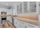 Beautiful kitchen featuring stainless steel appliances, granite counters, and white cabinetry at 18199 W Buckhorn Dr, Goodyear, AZ 85338