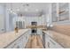 Gourmet kitchen with granite countertops, stainless appliances and a large island at 18199 W Buckhorn Dr, Goodyear, AZ 85338