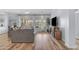 Bright living room with hardwood floors, large windows, and comfortable seating at 18199 W Buckhorn Dr, Goodyear, AZ 85338