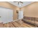 Spacious living area with couch, wood floors and a ceiling fan at 18199 W Buckhorn Dr, Goodyear, AZ 85338
