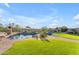 Lush backyard showcasing a custom pool, landscaping, and captivating desert views for serene outdoor enjoyment at 18199 W Buckhorn Dr, Goodyear, AZ 85338