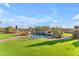 Expansive backyard showcasing a sparkling pool, lush landscaping, and scenic views for ultimate outdoor enjoyment at 18199 W Buckhorn Dr, Goodyear, AZ 85338