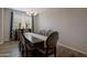 Elegant dining room featuring a large table, stylish chairs, and great lighting for memorable meals at 18837 W San Juan Ave, Litchfield Park, AZ 85340