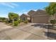 Home exterior with a wide driveway and desert landscaping at 18837 W San Juan Ave, Litchfield Park, AZ 85340