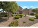 Single-Gathering home showcasing desert landscaping at 18837 W San Juan Ave, Litchfield Park, AZ 85340