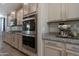 Gourmet kitchen with stainless steel appliances and granite counters at 18837 W San Juan Ave, Litchfield Park, AZ 85340