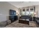 Cozy living room with a plush rug, comfortable sofa, media center, and lots of natural light at 18837 W San Juan Ave, Litchfield Park, AZ 85340