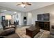 Comfortable living room with a ceiling fan, plush seating, and lots of space for relaxing or entertaining at 18837 W San Juan Ave, Litchfield Park, AZ 85340