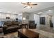 Open-concept living room and kitchen area with ample seating, modern appliances, and an airy feel at 18837 W San Juan Ave, Litchfield Park, AZ 85340