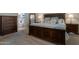 Spacious main bedroom featuring dark wood furniture, carpet, soft blue accents and plenty of soft natural light at 18837 W San Juan Ave, Litchfield Park, AZ 85340