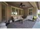 Inviting covered patio featuring comfortable seating and a ceiling fan at 18837 W San Juan Ave, Litchfield Park, AZ 85340