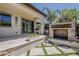 A covered patio, fireplace, and pool create a stunning outdoor oasis, perfect for relaxation and entertainment at 199 E Tangerine Path, Queen Creek, AZ 85140