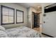 A bedroom with modern fixtures, an exterior view and dark trim at 199 E Tangerine Path, Queen Creek, AZ 85140