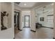 Inviting foyer with hardwood floors, decorative art niche, and views to the living area at 199 E Tangerine Path, Queen Creek, AZ 85140