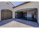 Garage with epoxy floor and brown doors at 199 E Tangerine Path, Queen Creek, AZ 85140