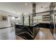 Gourmet kitchen features a large island with a marble countertop and stainless steel appliances at 199 E Tangerine Path, Queen Creek, AZ 85140