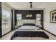 Beautifully designed main bedroom with large windows, elegant decor, and a modern ceiling fan at 199 E Tangerine Path, Queen Creek, AZ 85140