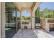 An outdoor kitchen features a built-in grill, counter space, and an inviting stone fireplace for entertaining at 199 E Tangerine Path, Queen Creek, AZ 85140