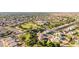 Expansive aerial view of a well-developed neighborhood with lush green spaces and a community park at 2004 N 125Th Ave, Avondale, AZ 85392