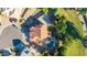 Aerial view of a home with a red tile roof, backyard pool and patio, and mature landscaping in a suburban neighborhood at 2004 N 125Th Ave, Avondale, AZ 85392