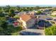 Aerial view of a property showcasing a pool, basketball court, lush landscaping, and a terracotta roof at 2004 N 125Th Ave, Avondale, AZ 85392